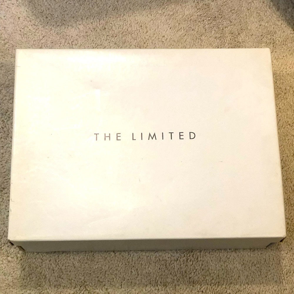 The limited high heel shoes. Excellent knock off with a MK snake skin purse.
